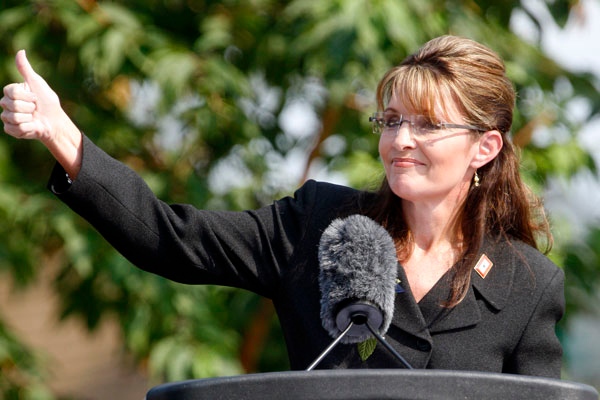 Alaska Gov. Sarah Palin gives a thumbs up during her resignation speech during a ceremony in Fairbanks, Alaska, Sunday, July 26, 2009. (AP / Al Grillo)