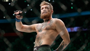 In this Oct. 6, 2018, file photo, Conor McGregor walks in the cage before fighting Khabib Nurmagomedov in a lightweight title mixed martial arts bout at UFC 229 in Las Vegas. (AP Photo/John Locher, File)