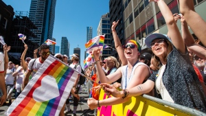 Revelers in the crowd cheer along the route of the 2019 Pride Parade in Toronto, Saturday, June 23, 2019. THE CANADIAN PRESS/Andrew Lahodynskyj