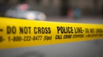 Police tape is shown in this file photo. (Graeme Roy / THE CANADIAN PRESS)