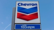 This May 2, 2017 file photo shows a Chevron sign at a gas station in Miami, Fla. (AP Photo/Alan Diaz, File)