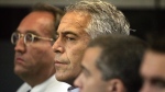 In this July 30, 2008, file photo, Jeffrey Epstein, centre, appears in court in West Palm Beach, Fla. (Uma Sanghvi / Palm Beach Post via AP, File)