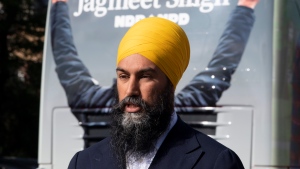 NDP leader Jagmeet Singh speaks to the media beside the campaign bus during a stop in Montreal, Monday, September 16, 2019. THE CANADIAN PRESS/Adrian Wyld