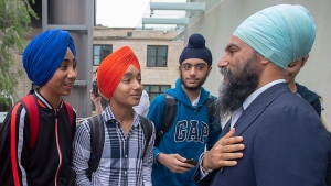NDP Leader Jagmeet Singh chats with young supporters during a campaign stop at the University of Manitoba in Winnipeg on Tuesday, Sept. 24, 2019. THE CANADIAN PRESS/Andrew Vaughan