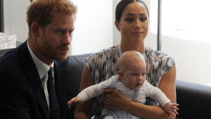 Prince Harry and Meghan holding Archie
