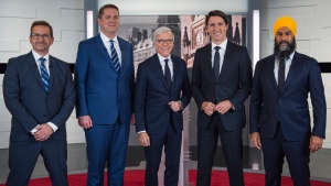 Leader of the Bloc Quebecois Yves-Francois Blanchet, left to right, Conservative Leader Andrew Scheer, TVA host Pierre Bruneau, Liberal Leader Justin Trudeau and NDP Leader Jagmeet Singh pose for a photo at the TVA french debate for the 2019 federal election, in Montreal, Wednesday, Oct. 2, 2019. THE CANADIAN PRESS/Joel Lemay, POOL