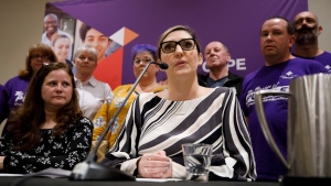 Laura Walton, president of OSBCU, middle, speaks alongside Darcie McEathron, CUPE's school board coordinator, left, and the bargaining committee to announce a tentative deal reached with CUPE and the Ontario provincial government in Toronto, Sunday, Oct. 6, 2019. THE CANADIAN PRESS/ Cole Burston
