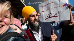 NDP leader Jagmeet Singh poses for photographs during a campaign stop in Toronto on Tuesday, October 15, 2019. THE CANADIAN PRESS/Nathan Denette