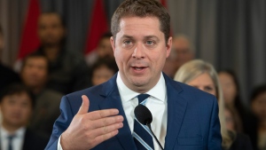 Conservative leader Andrew Scheer responds to questions from the media during a campaign stop in Toronto. Saturday, October 19, 2019. THE CANADIAN PRESS/Adrian Wyld