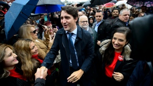 Liberal leader Justin Trudeau and Liberal candidate Sara Badiei make a campaign stop in Port Moody, B.C., on Sunday Oct. 20, 2019. THE CANADIAN PRESS/Sean Kilpatrick