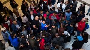NDP leader Jagmeet Singh is swarmed by people in a mall during a campaign stop in Surrey, B.C., on Sunday, October 20, 2019. THE CANADIAN PRESS/Nathan Denette