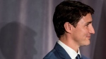 Prime Minister Justin Trudeau listens to an emcee after speaking during a Liberal Party fundraising dinner in Vancouver, on Wednesday May 22, 2019. THE CANADIAN PRESS/Darryl Dyck