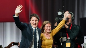 Liberal leader Justin Trudeau and wife Sophie Gregoire Trudeau wave as they go on stage at Liberal election headquarters in Montreal, Monday, Oct. 21, 2019. THE CANADIAN PRESS/Paul Chiasson