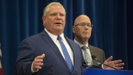 Ontario Premier Doug Ford speaks to reporters with MPP Steve Clark, Minister of Municipal Affairs and Housing, in Toronto, on Monday, September 10, 2018. THE CANADIAN PRESS/Christopher Katsarov.