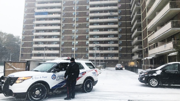 Police are seen outside an apartment building after an air conditioner fell on a child on Nov. 11, 2019. (Corey Baird/CTV News Toronto)