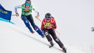Brittany Phelan of Canada followed by Alexandra Edebo of Sweden during the FIS World Cup Women's Freestyle Skicross competition in Idre, Sweden,Saturday. Jan. 25, 2020. (Pontus Lundahl / TT via AP)