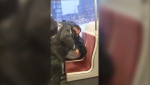 A TTC Special Constable is seen involved in a violent altercation on the 501 streetcar. (Twitter/@CascadingDesign)