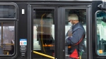 A TTC worker wears a mask in a bus while on shift in Toronto on Thursday, April 23, 2020. THE CANADIAN PRESS/Nathan Denette