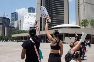 Protesters gather at city hall in Toronto to honour black lives lost at the hands of police, on Friday, June 5, 2020. THE CANADIAN PRESS/Chris Young