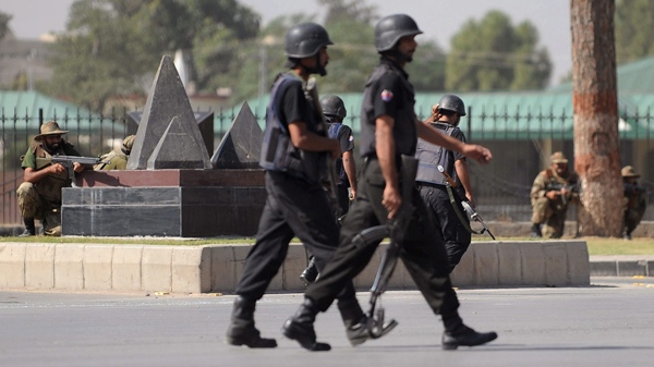 Pakistan troops take positions outside army headquarters in Rawalpindi, after an attack on Saturday, Oct. 10, 2009. (AP Photo)
