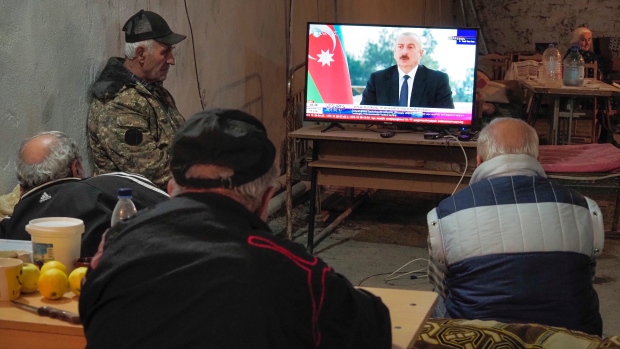 Armenians watch President Ilham Aliyev