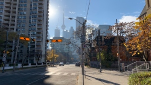 The sun rises over Toronto's downtown core on an unseasonably warm day November 9, 2020. (Joshua Freeman /CP24)