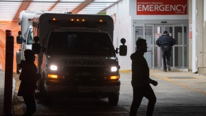 People pass by a hospital emergency in Toronto on Wednesday, November 18, 2020. THE CANADIAN PRESS/Frank Gunn
