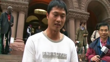 Wang Chen, who owns the Lucky Moose Food Mart, is seen outside of the Old City Hall Courts on Thursday, Oct. 22, 2009.