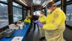 Toronto Paramedics prepare the Mobile COVID-19 TTC testing bus at a stop in Toronto December 9, 2020. THE CANADIAN PRESS/Frank Gunn