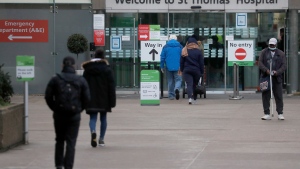 The busy entrance of a hospital in London, Wednesday, Dec. 30, 2020. (AP Photo/Frank Augstein)