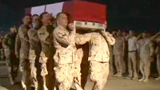 The casket of Sapper Steven Marshall is carried towards a plane during  ramp ceremony at Kandahar Airfield, Afghanistan, on Saturday, Oct. 31, 2009.