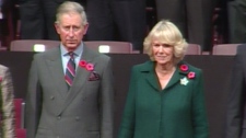 Prince Charles and his wife the Duchess of Cornwall listen to a children's choir sing 'God Save the Queen' in St. John's, N.L., on Monday, Nov. 2, 2009.