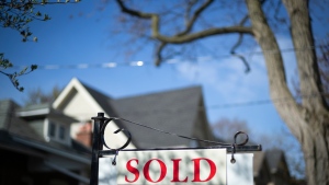 A real estate sold sign is shown in a Toronto west end neighbourhood May 17, 2020. THE CANADIAN PRESS/Graeme Roy