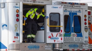 A paramedic closes the doors on his ambulance at a hospital in Toronto on Tuesday, April 6, 2021. THE CANADIAN PRESS/Frank Gunn