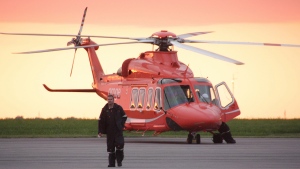 An Ornge air ambulance helicopter is secured on the tarmac in Kingston, Ont. on Monday June 9, 2014. THE CANADIAN PRESS/Colin Perkel