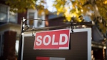 A real estate sold sign hangs in front of a west-end Toronto property Friday, Nov. 4, 2016. THE CANADIAN PRESS/Graeme Roy 