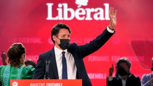 Liberal Leader Justin Trudeau greets supporters prior to his victory speech at Party campaign headquarters in Montreal, early Tuesday, Sept. 21, 2021. THE CANADIAN PRESS/Paul Chiasson 