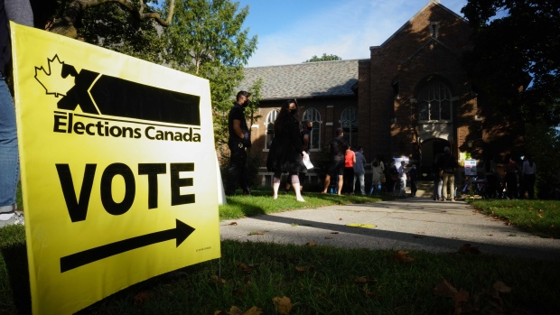 People start to line up early for the Canadian general election before polls open in west-end Toronto for the Monday, Sept. 20, 2021. THE CANADIAN PRESS/Graeme Roy 