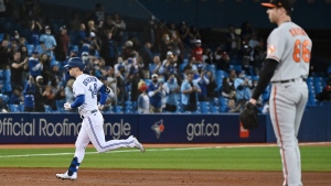 Toronto Blue Jays' Corey Dickerson (14) rounds the bases after hitting a solo home run off Baltimore Orioles' pitcher Brooks Kriske, right, in the sixth American League baseball game against the Baltimore Orioles in Toronto on Friday, Oct. 1, 2021. THE CANADIAN PRESS/Jon Blacker