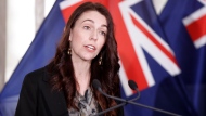 FILE- New Zealand Prime Minister Jacinda Ardern announces in Wellington, Friday, Oct. 22, 2021, an ambitious target of fully vaccinating 90% of eligible people to end coronavirus lockdowns. (Robert Kitchin/Pool Photo via AP)