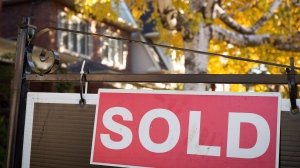 A real estate sold sign hangs in front of a home in this file photo dated Nov. 4, 2016.THE CANADIAN PRESS/Graeme Roy