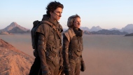 This image released by Warner Bros. Pictures shows Timothee Chalamet, left, and Rebecca Ferguson in a scene from "Dune." (Warner Bros. Pictures via AP) 
