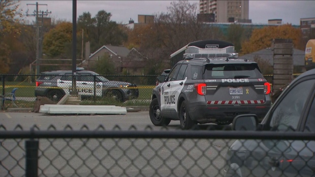 Police vehicles are shown at the scene of a stabbing at Victoria Park Collegiate on Tuesday afternoon.