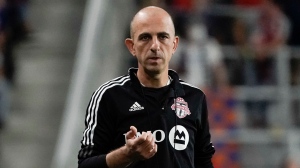 Toronto FC head coach Javier Perez stands on the sidelines during the second half of an MLS soccer match against FC Cincinnati Saturday, Sept. 11, 2021, in Cincinnati. (AP Photo/Jeff Dean) 