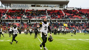 Hamilton Tiger-Cats quarterback Dane Evans (9) celebrates after defeating the Toronto Argonauts in CFL Eastern Conference final action in Toronto, on Sunday, December 5, 2021. THE CANADIAN PRESS/Christopher Katsarov 
