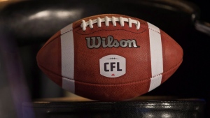 A football with the new CFL logo sits on a chair in Winnipeg on November 27, 2015. THE CANADIAN PRESS/John Woods 