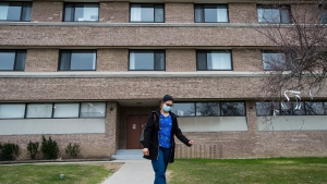 A healthcare worker leaves after finishing her shift for the day at the Eatonville Care Centre in Toronto on Friday, April 24, 2020. THE CANADIAN PRESS/Nathan Denette