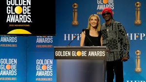 Helen Hoehne, president of the Hollywood Foreign Press Association, left, and Snoop Dogg, pose following the nominations event for 79th annual Golden Globe Awards at the Beverly Hilton Hotel on Monday, Dec. 13, 2021, in Beverly Hills, Calif. The 79th annual Golden Globe Awards will be held on Sunday, Jan. 9, 2022. (AP Photo/Chris Pizzello)