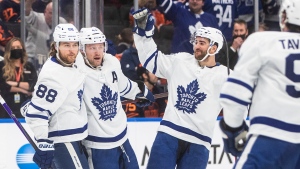 Toronto Maple Leafs' William Nylander (88), Morgan Rielly (44) and T.J. Brodie (78) celebrate a goal against the Edmonton Oilers during third period NHL action in Edmonton on Tuesday, December 14, 2021.THE CANADIAN PRESS/Jason Franson 