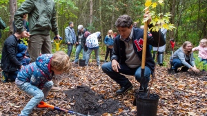 FILE - Federal Liberal leader Justin Trudeau plants a tree with his sons Hadrien and Xavier at the Frank Conservation Area in Plainfield, Ont. on Sunday, October 6, 2019. THE CANADIAN PRESS/Frank Gunn 